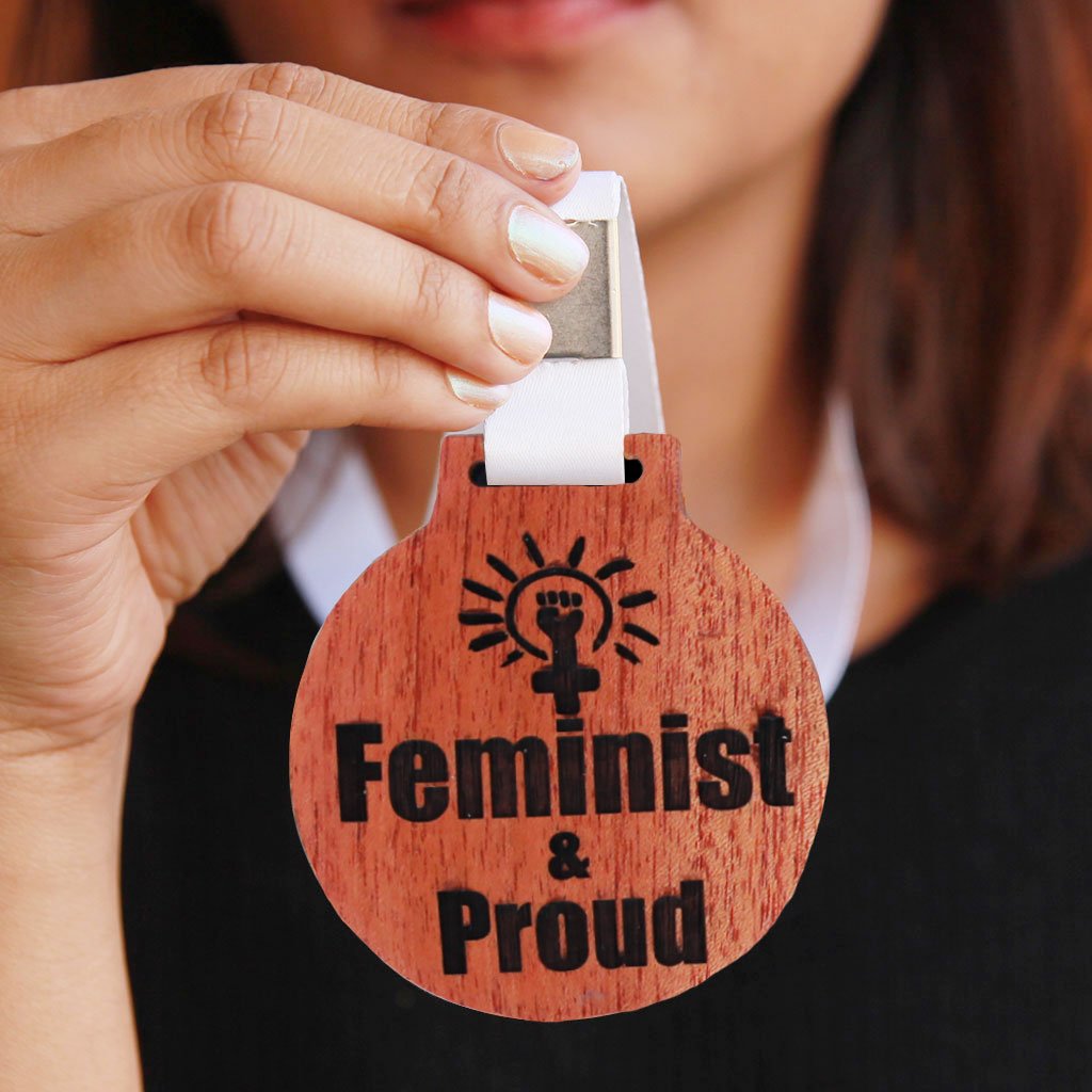 Feminist & Proud Wooden Medal With Ribbon - This Is A Feminist Pin To Wear Proudly - It is a great gift for a feminist friend and the best gifts for women.