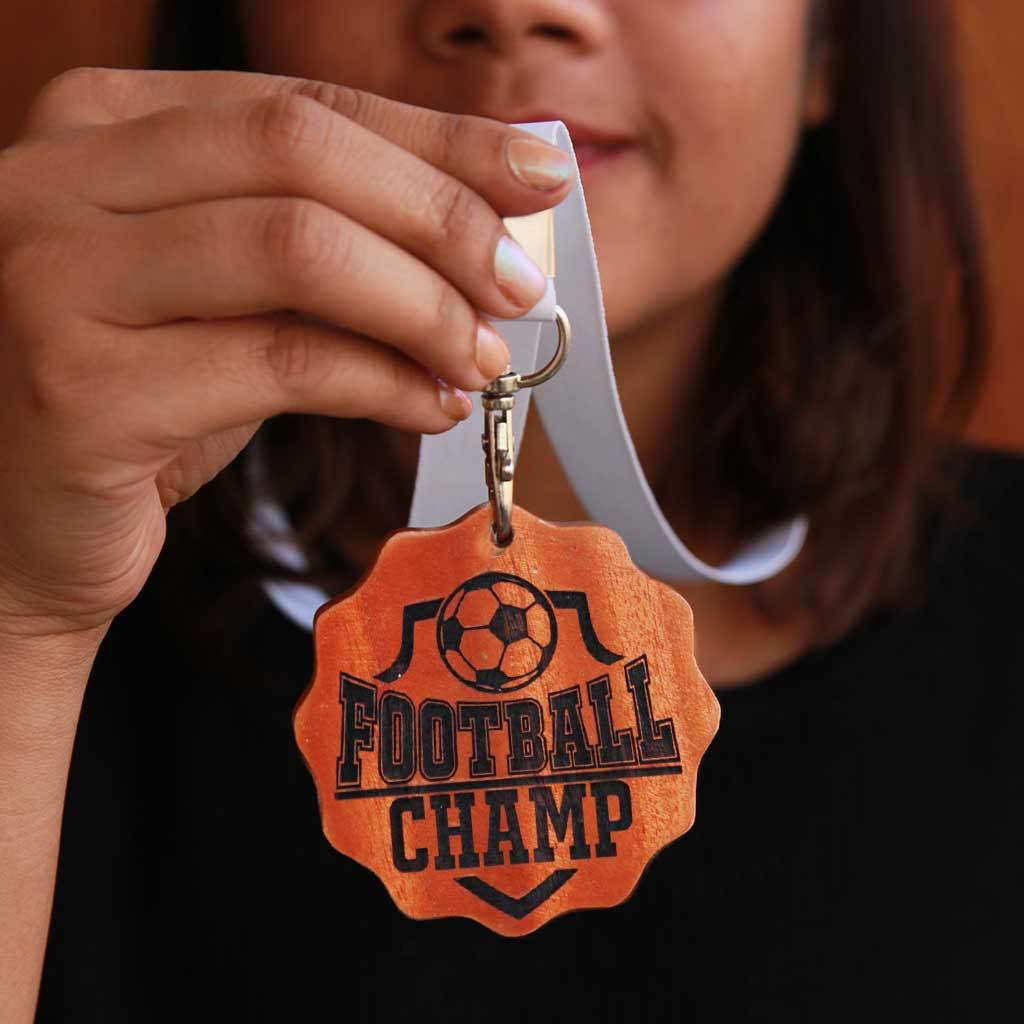Football Champ Engraved Medal. Football Medal For The Best Footballer. These Unique Custom Medals Make One Of The Best Gifts For Football Fans. Buy More Sports Medals Online From The Woodgeek Store.
