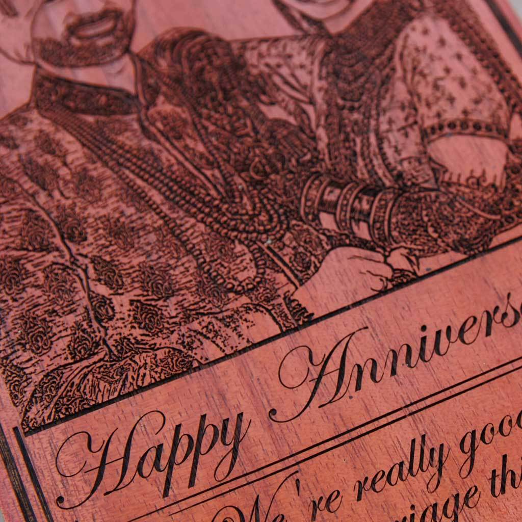 Happy Anniversary: We're really good at this marriage thing wood engraved photo. A photo on wood along with carved funny anniversary wishes. This photo gift is the best anniversary gift for husband or wife.