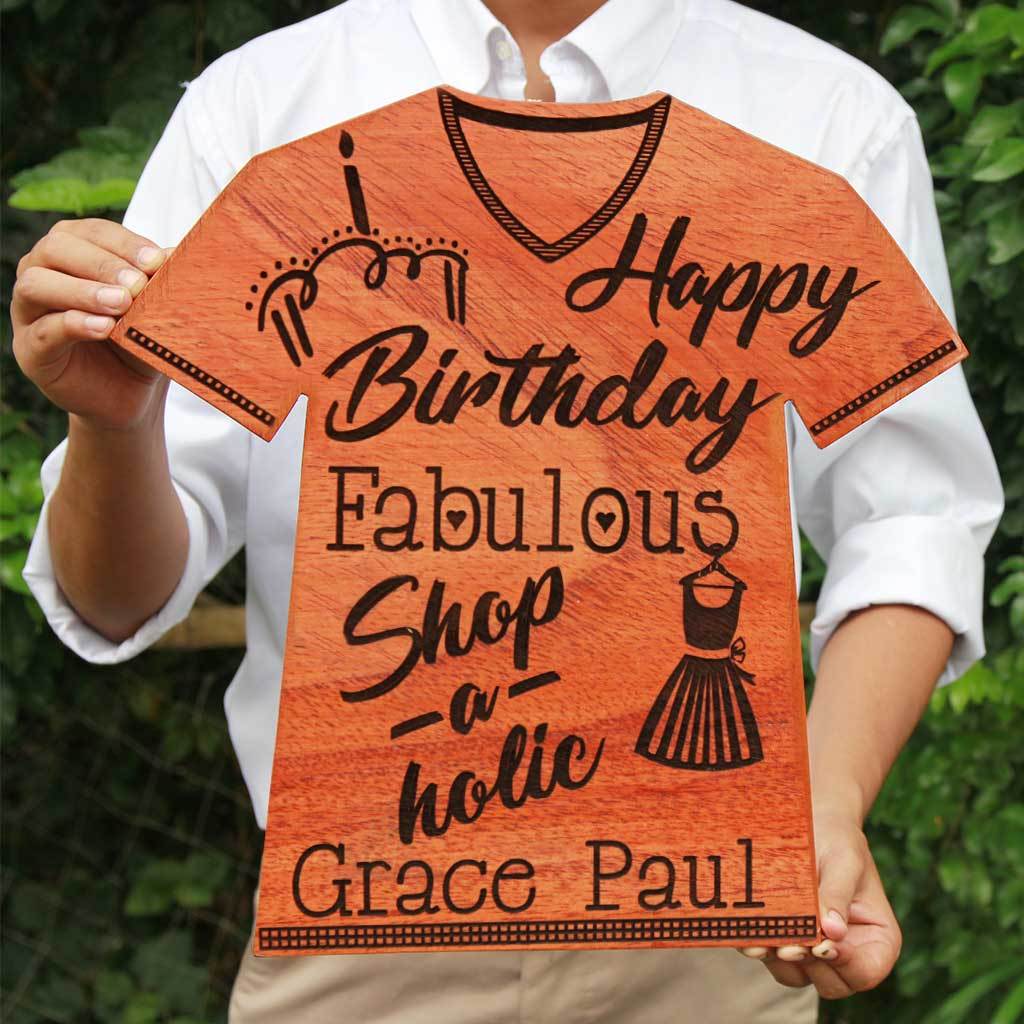 Happy Birthday Fabulous Shopaholic Wooden Plaque In The Shape Of A T-shirt. This Personalized Award Trophy Makes One Of The Best Gifts For Shopaholics - Looking For Unique Birthday Gifts ? Shop The Best Gifts For Loved Ones From The Woodgeek Store. 