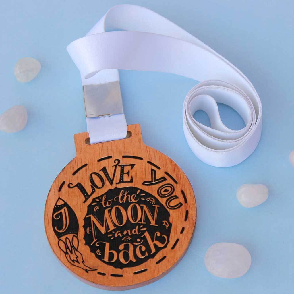 I Love You To The Moon And Back Medal Of Love. This Medal Is A Very Romantic Gift For Him And Her. These Medals And Trophies Also Make Great Gift For Family. 
