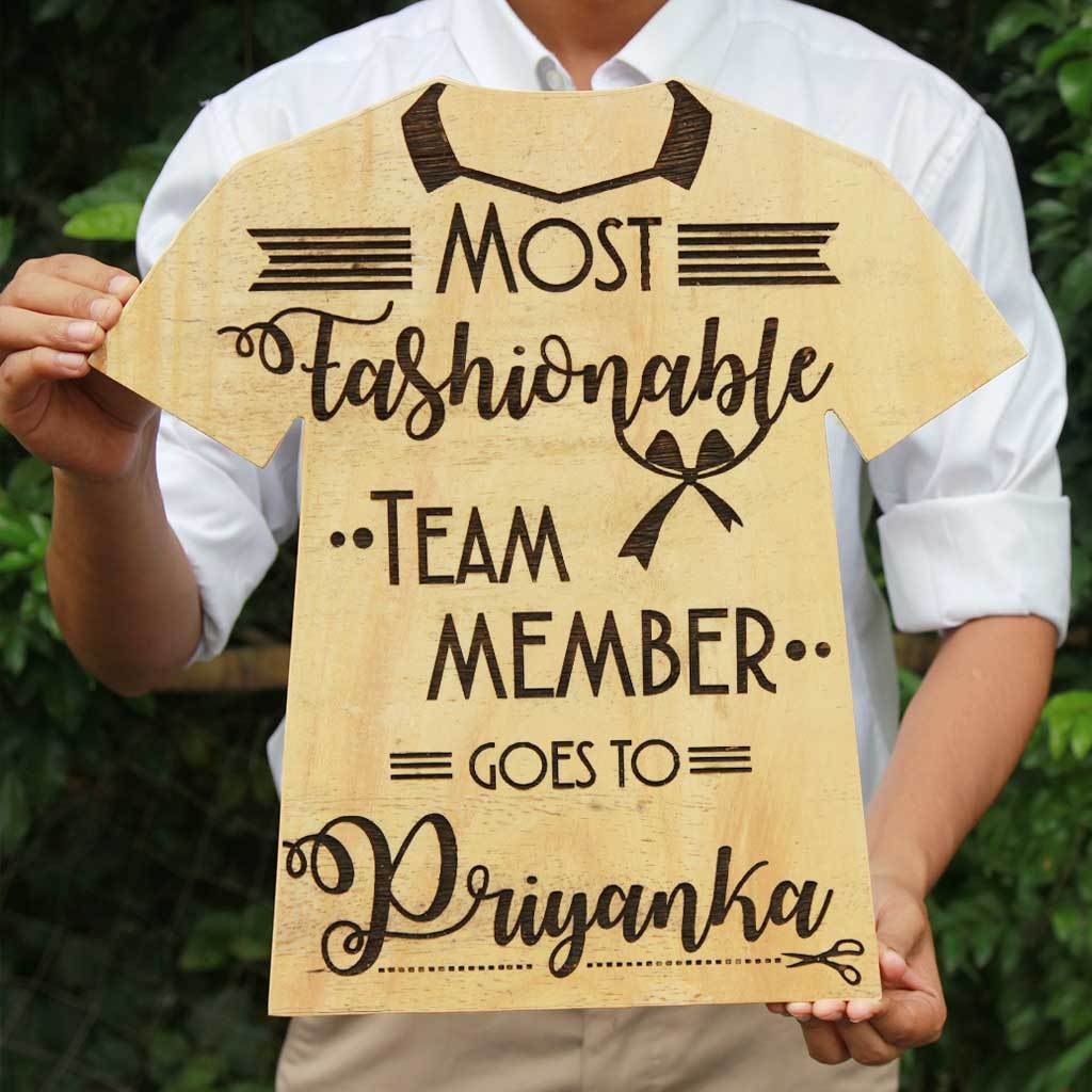 Most Fashionable Team Member Wooden T-shirt Award Plaque. These Wooden Trophies & Awards Make Unique Gifts For Employees. This Is a Highly Coveted Employee Awards Titles. Custom Trophies Are Great Gifts For Fashion Lovers.