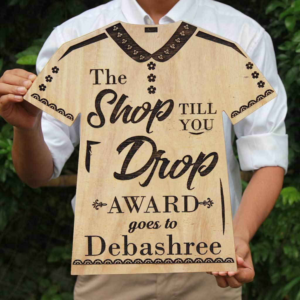 The Shop Till You Drop Wooden T-Shirt Award Trophy. This Personalized Wooden Plaque Is The Best Gift For A Shopaholic. Funny Awards For Friends and Colleagues. Buy More Fashion Awards Online From The Woodgeek Store.