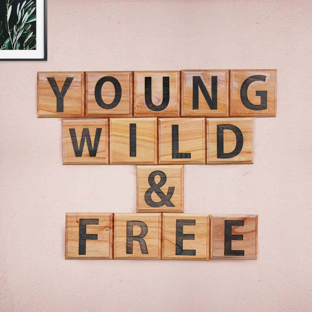 Young, Wild & Free Wooden Crossword Blocks. These Unique Crossword & Scrabble Wall Art Make Great Gifts For Youngsters And Amazing Wall Decor.