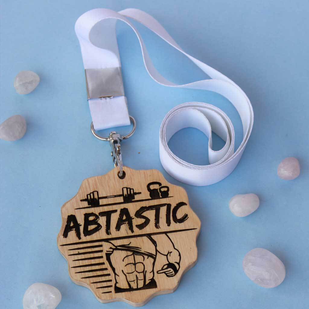 Abtastic Engraved Medal. This Is The Best Gift For Fitness Lovers. Buy More Customised Gifts For Fitness Enthusiasts From The Woodgeek Store.