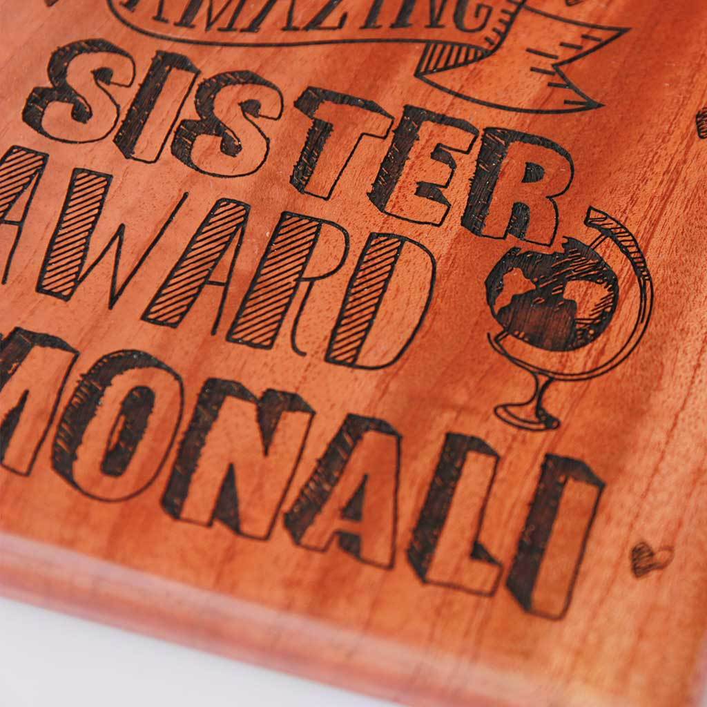 World&#39;s Most Amazing Sister Award. This Wooden Trophy makes great gifts for sister. Custom trophies engraved with name makes a good birthday gift for sister. This Custom Award is a Funny Gift for an amazing Sister.