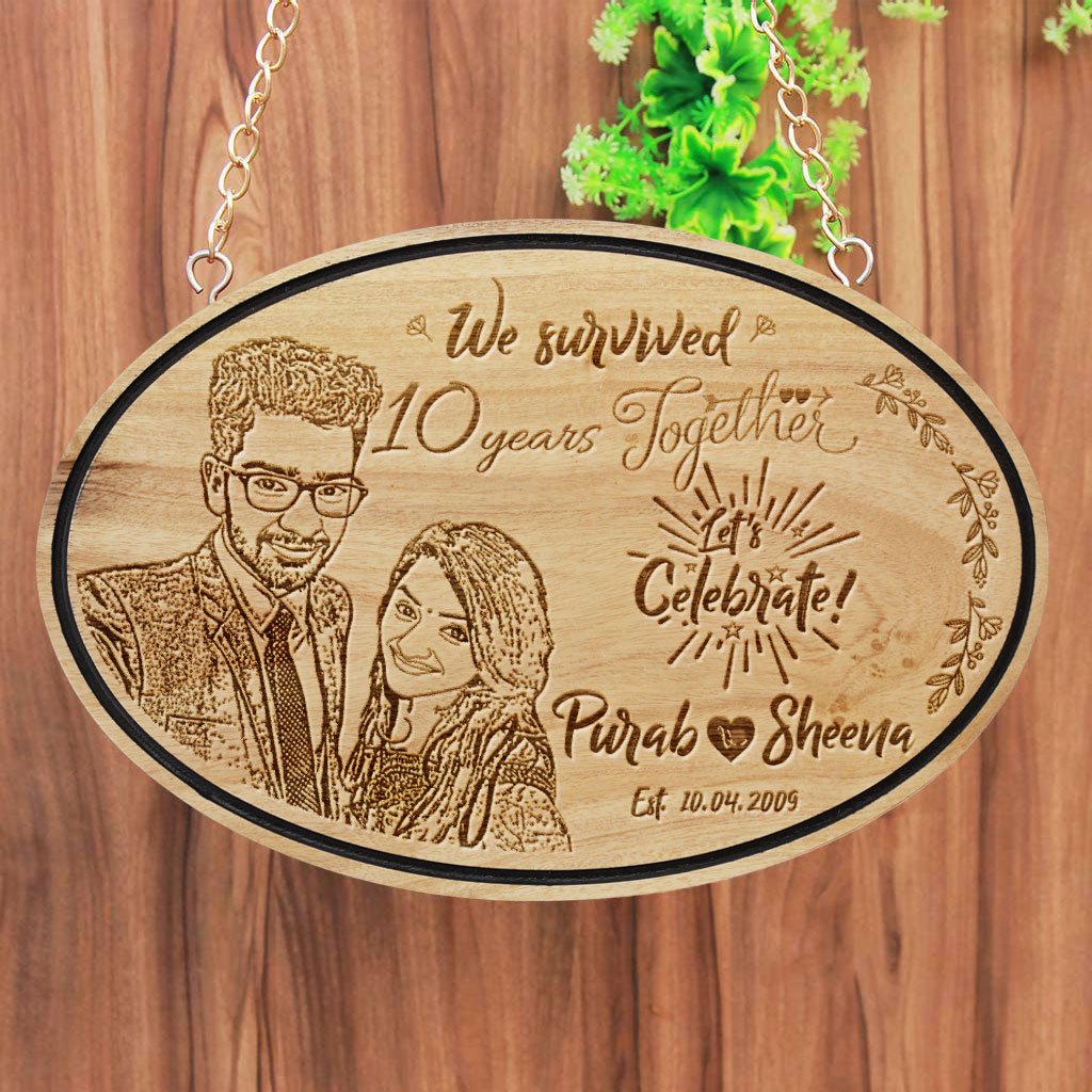 We Survived Funny Anniversary Wishes Engraved On Hanging Wooden Sign. This wood engraved photo is makes great photo gifts. This Personalized Wooden Plaque Is A Funny Anniversary Gift For Him And Her - These Hanging Name Signs Also Make Great Party Accessories For Anniversary Parties.