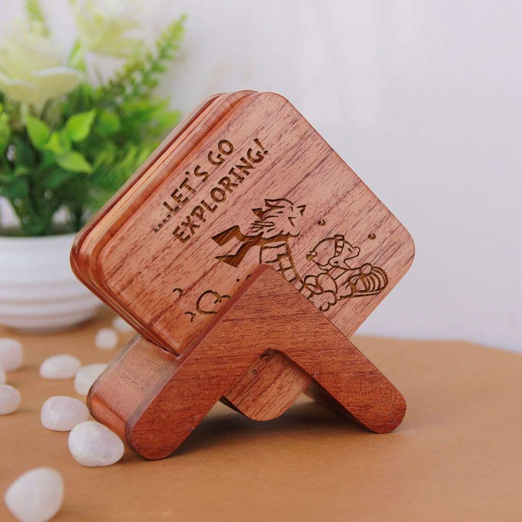 Calvin and Hobbes - Wooden Coaster Set With Holder. Gift coasters engraved with Calvin and Hobbes quotes. This coaster set is the best engraved wooden coasters and funky coaster which can be used as tea coaster and coffee coaster. This square coaster and natural wood coaster is one of the best gifts for Calvin and Hobbes fans.