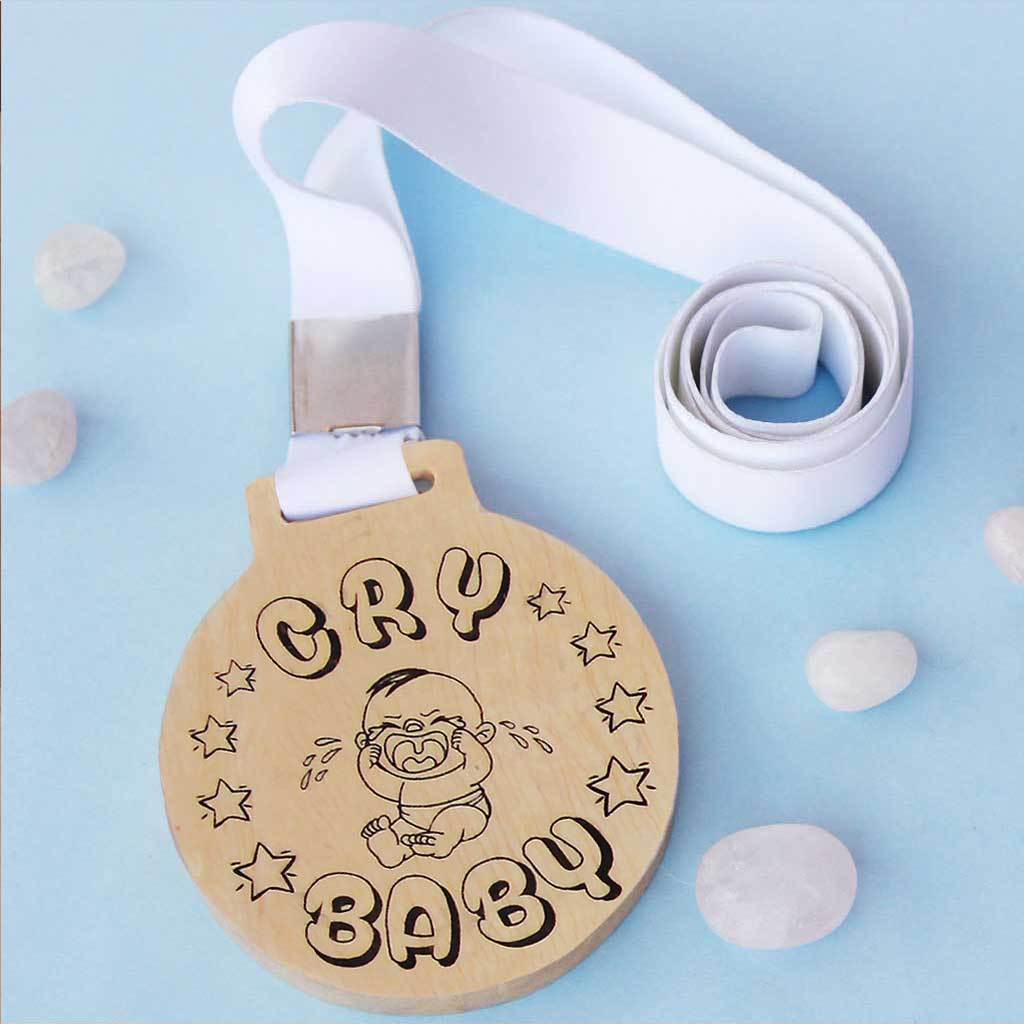 Cry Baby Wooden Medal With Ribbon. This funny medal is the best gift for a sentimental friend, colleague, brother or sister.