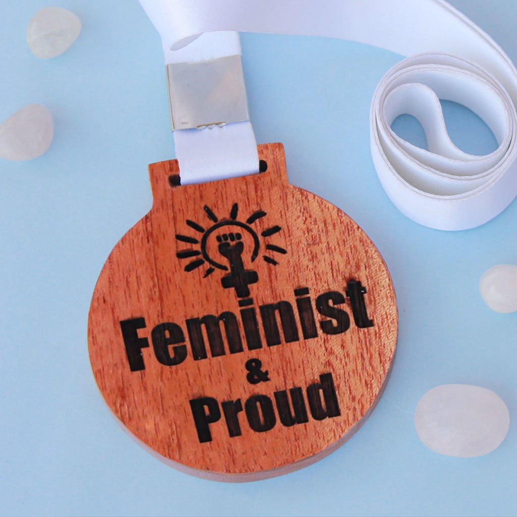 Feminist &amp; Proud Wooden Medal With Ribbon - This Is A Feminist Pin To Wear Proudly - It is a great gift for a feminist friend and the best gifts for women.