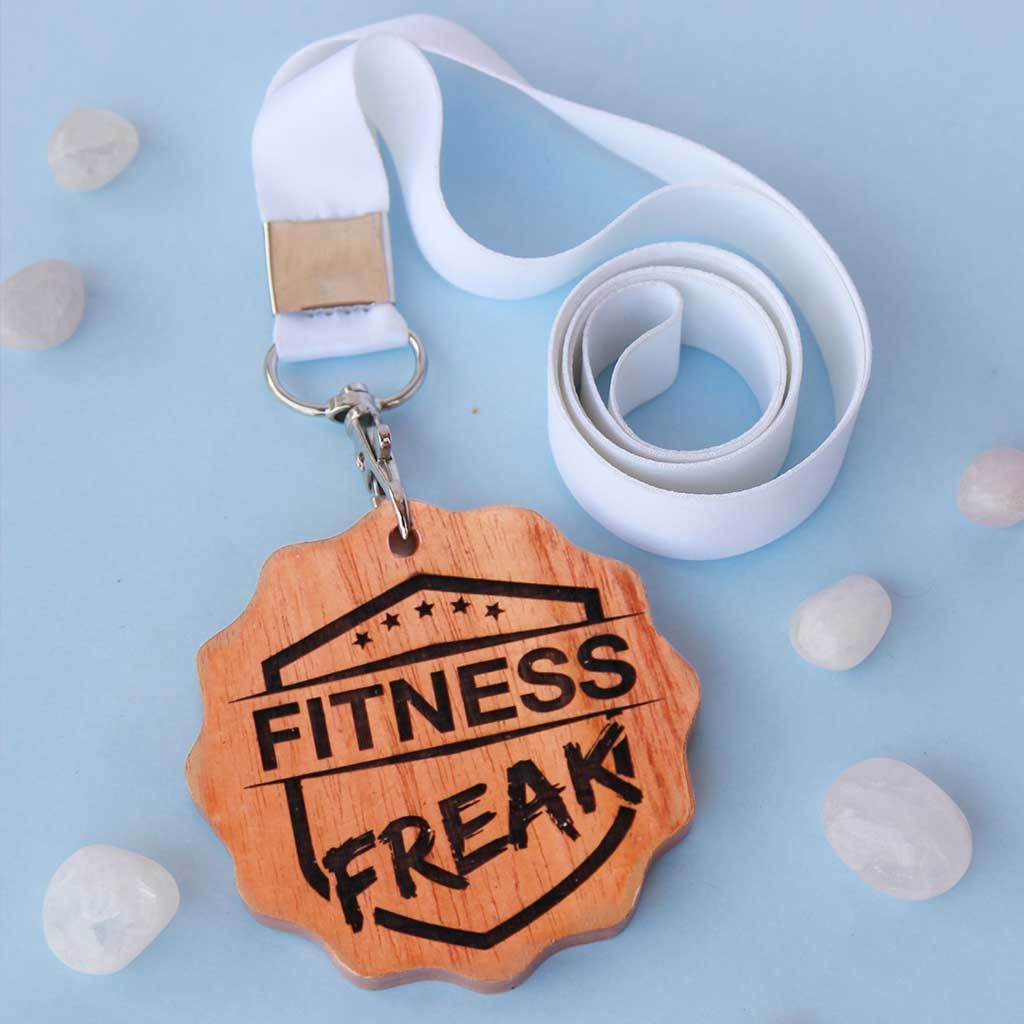 Fitness Freak Engraved Medal. A funny award for the fitness freak of your life. This wooden medal makes funny gift ideas for fitness lovers.