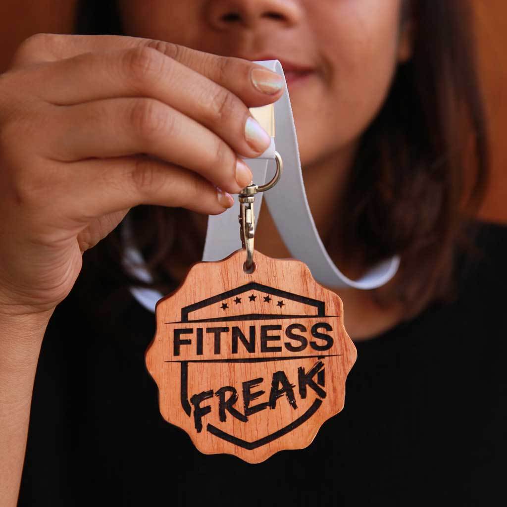 Fitness Freak Engraved Medal. A funny award for the fitness freak of your life. This wooden medal makes funny gift ideas for fitness lovers. 