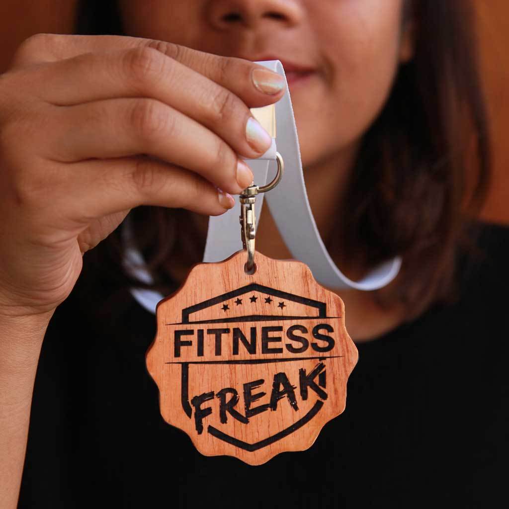 Fitness Freak Engraved Medal. A funny award for the fitness freak of your life. This wooden medal makes funny gift ideas for fitness lovers.