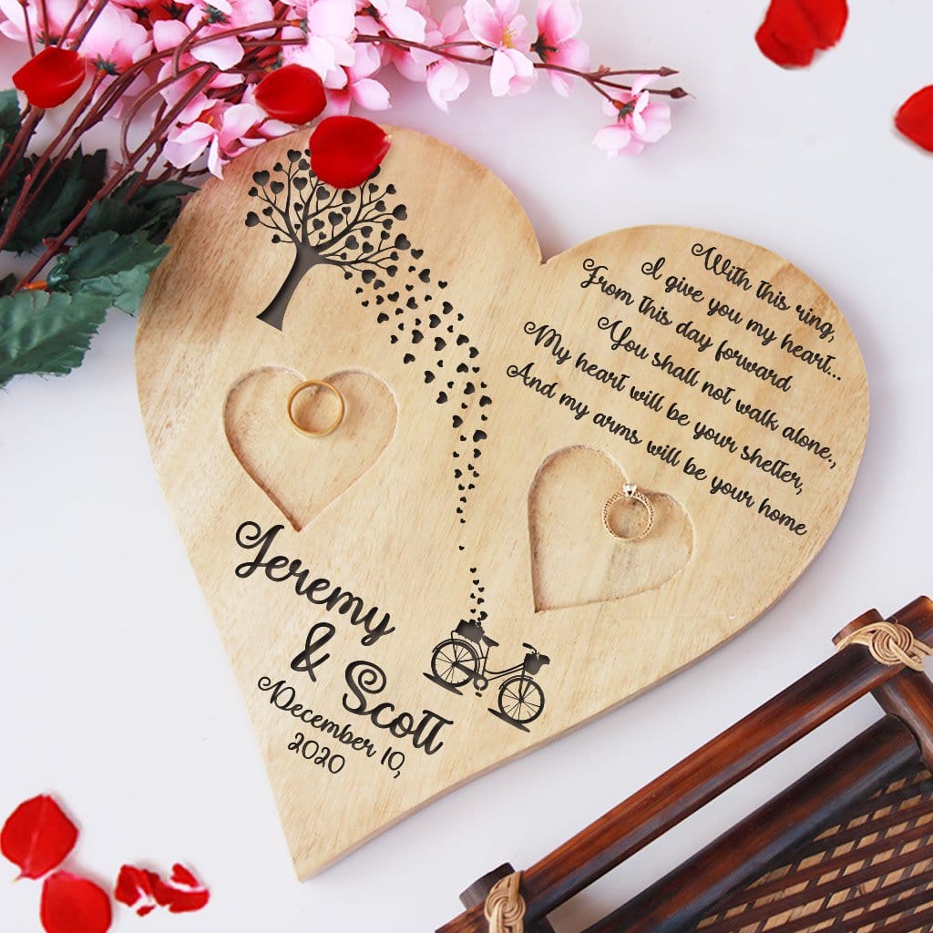 Wooden Heart Shaped Ring Holder Engraved With A Love Quote: With this ring, I give you my heart...From this day forward, You shall not walk alone. My heart will be your shelter, And my arms will be your home. This Personalised Ring Tray Is Engraved With Couple Names & Wedding Date. This engagement ring tray is one of the best engagement gifts for couples and wedding gifts.