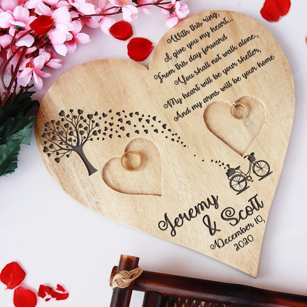 Wooden Heart Shaped Ring Holder Engraved With A Love Quote: With this ring, I give you my heart...From this day forward, You shall not walk alone. My heart will be your shelter, And my arms will be your home. This Personalised Ring Tray Is Engraved With Couple Names & Wedding Date. This engagement ring tray is one of the best engagement gifts for couples and wedding gifts.