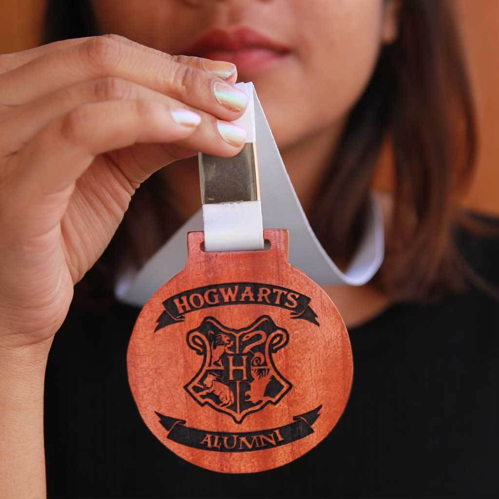 Hogwarts Alumni Engraved Medal With Ribbon. These award medals make the perfect best gifts for Harry Potter fans. Buy unique Harry Potter gifts online from The Woodgeek Store