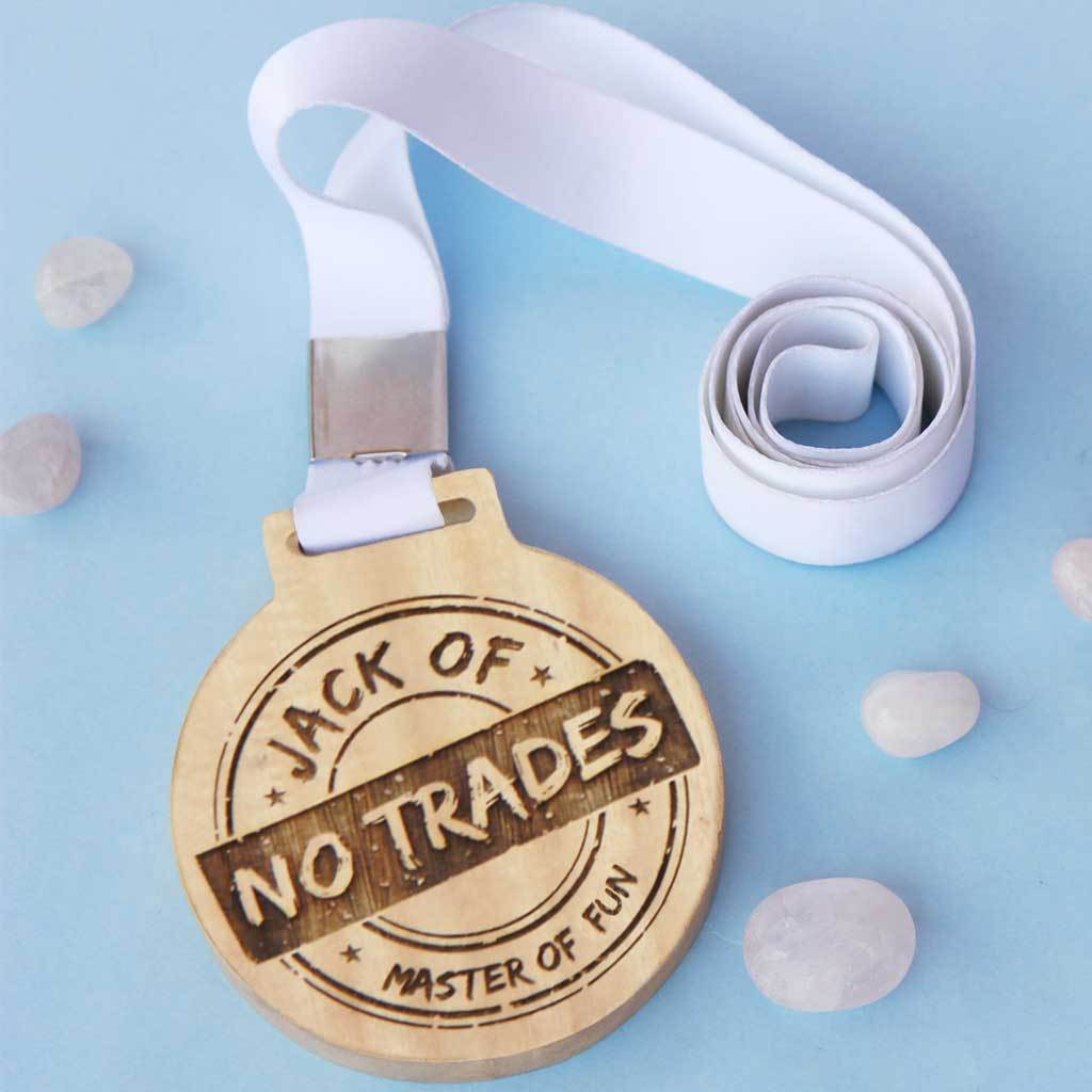 Jack of No Trade, Master Of Fun Wooden Medal With Ribbon. This funny medal will make a funny award for a coworker or a funny gift for a friend.