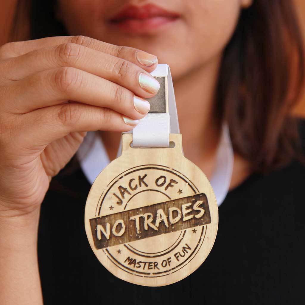 Jack of No Trade, Master Of Fun Wooden Medal With Ribbon. This funny medal will make a funny award for a coworker or a funny gift for a friend.