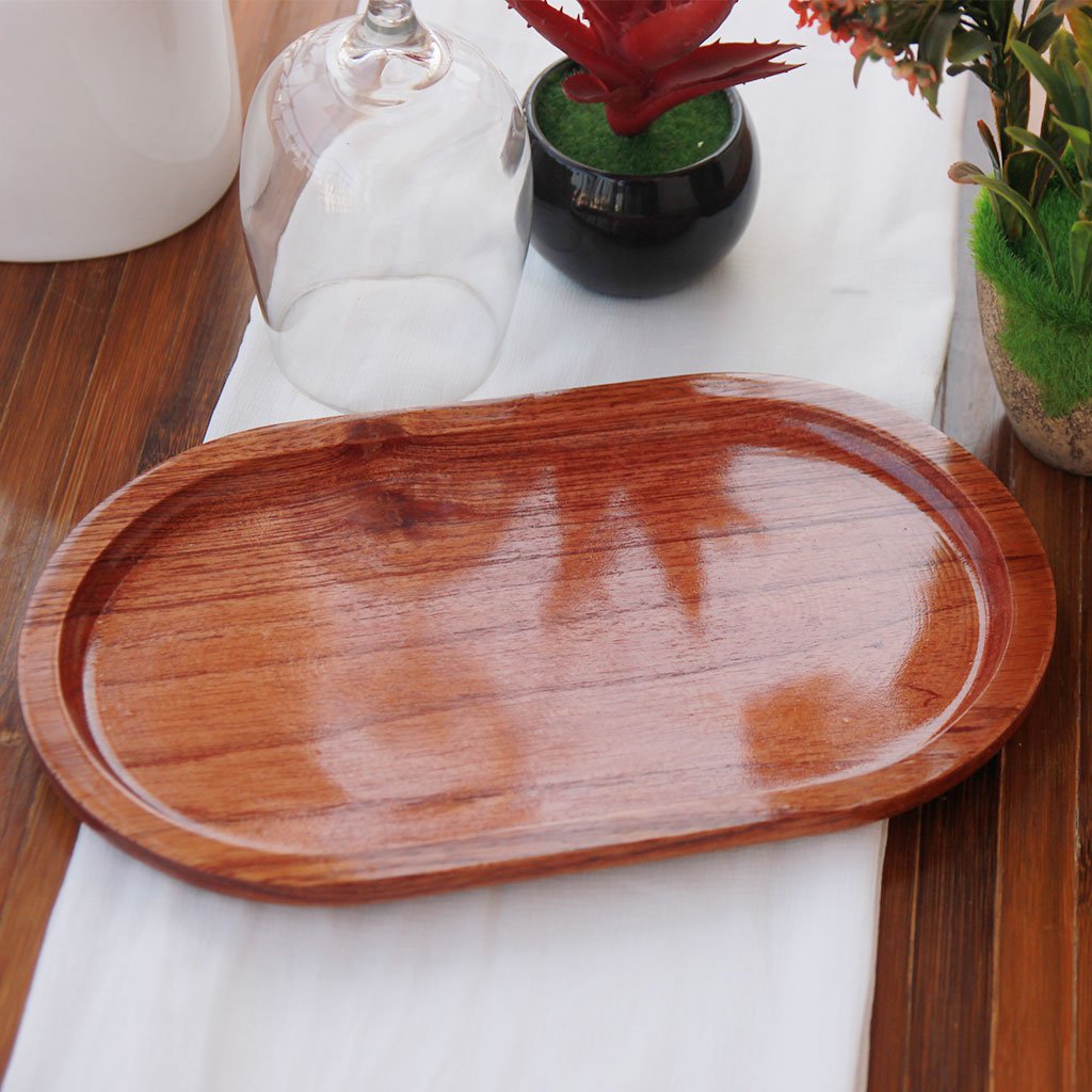 Oval Shaped Mahogany Wood Tray for serving food and drinks. This wooden tray can also be used for decorative purposes