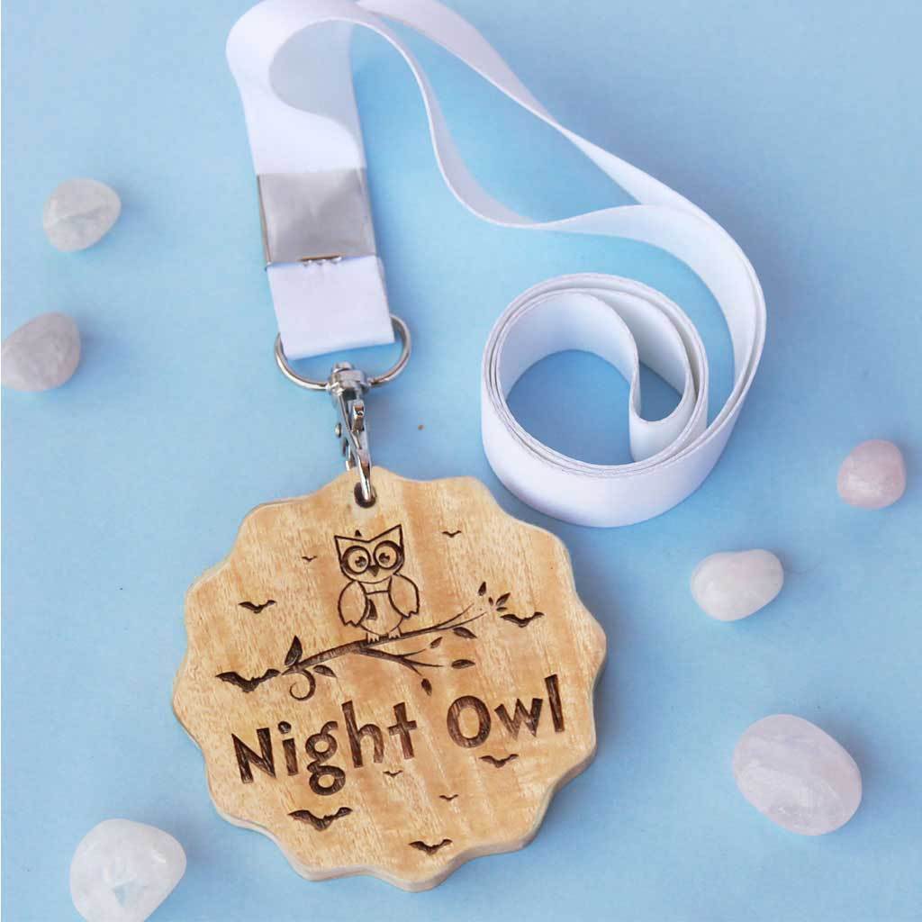 Night Owl Engraved Wooden Medal. A funny award makes great presents for friends. This custom medal is a funny gift for friends who stay up all night. Buy medals online from Woodgeek Store.