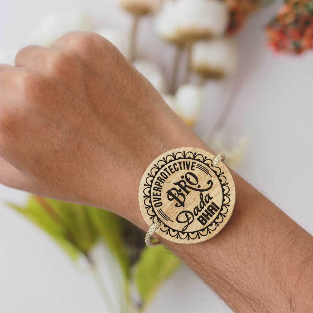 Overprotective Bro Personalized Rakhi for Brother & Raksha Bandhan Greeting Card - This Wooden Fancy Rakhi Can be Personalized With A Name - This Customized Rakhi Also Comes With A Wooden Rakhi Card Engraved With Raksha Bandhan Greetings - Buy Beautiful Rakhi Online And Personalized Rakhi Gifts For Brother Or Sister From The Woodgeek Store.