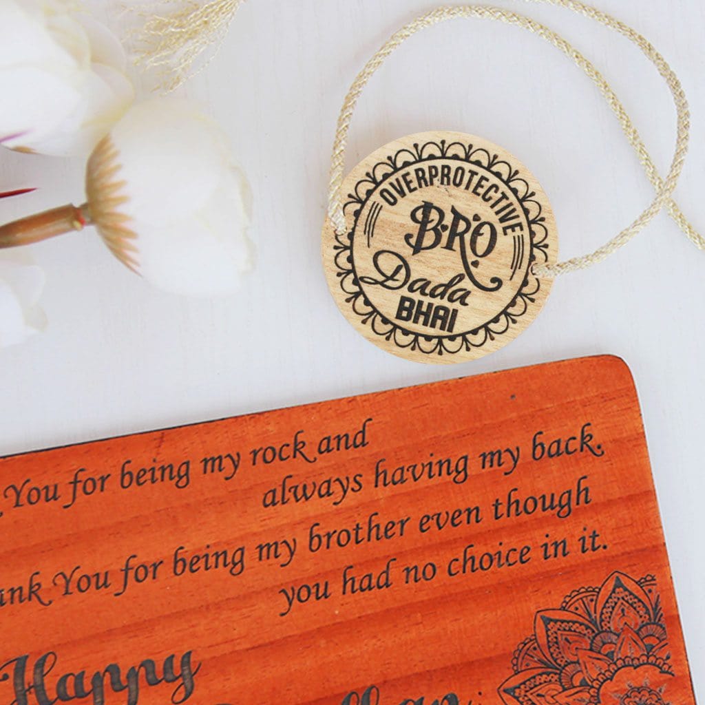 Overprotective Bro Personalized Rakhi for Brother &amp; Raksha Bandhan Greeting Card - This Wooden Fancy Rakhi Can be Personalized With A Name - This Customized Rakhi Also Comes With A Wooden Rakhi Card Engraved With Raksha Bandhan Greetings - Buy Beautiful Rakhi Online And Personalized Rakhi Gifts For Brother Or Sister From The Woodgeek Store.