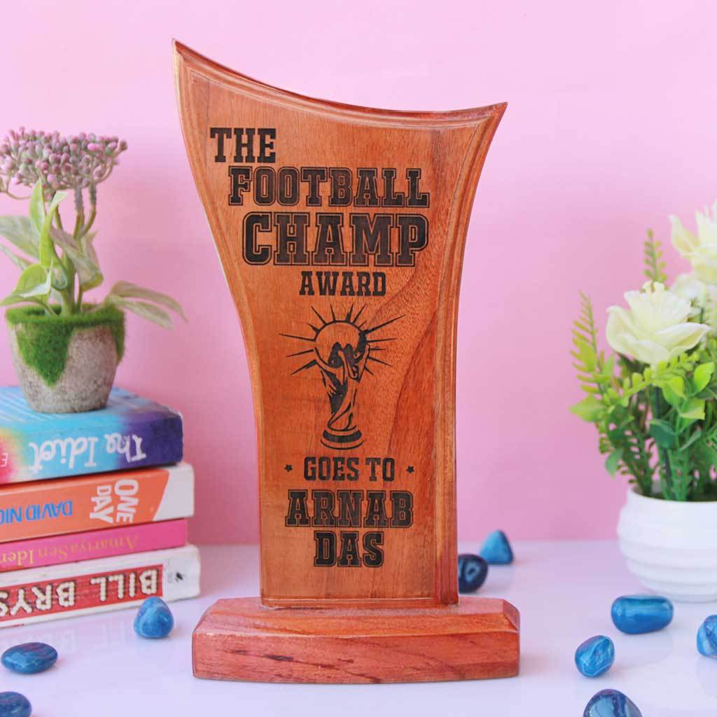 The Football Champ Wooden Football Trophy. Looking for personalised football gifts for friends? These sports trophies make special gift ideas for the football crazy friend.