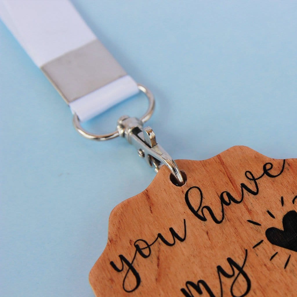 A Set Of 2 Wooden Medal For Friends Engraved With The Words: You are the most dependable friend & Your presence is the solution. These medals make affordable gifts for friends and the best personalised gifts for friends.