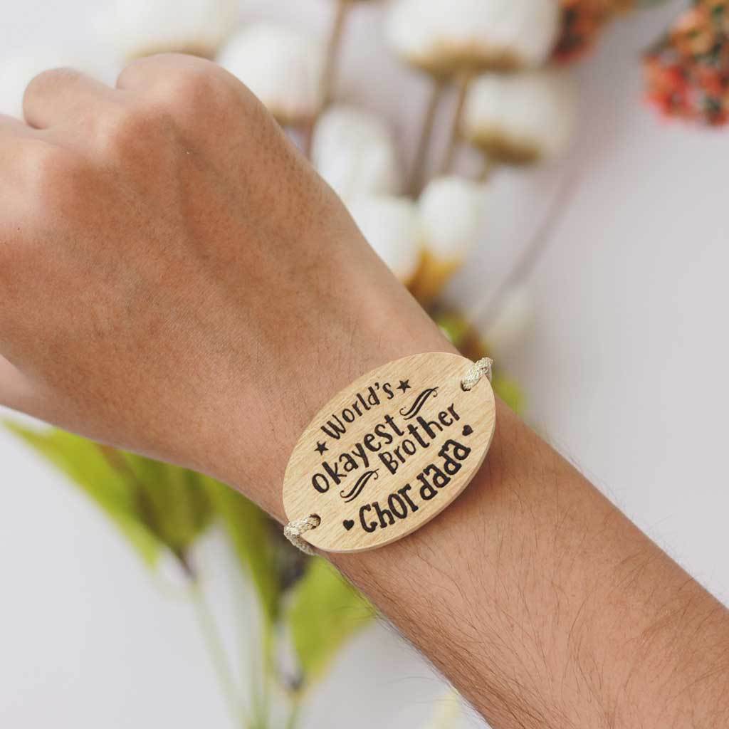 World&#39;s Okayest Brother Personalised Rakhi With Name. This Wooden Rakhi Is The Best Raksha Bandhan Gifts for Brother. Buy Rakhi Online India And Wish Your Brother a Happy Rakhi With Personalized Gifts From The Woodgeek Store.