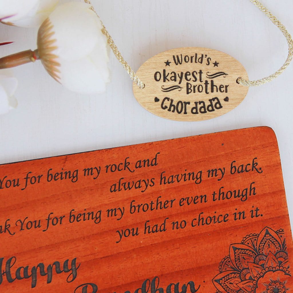 World's Okayest Brother Personalised Rakhi With Name. This Wooden Rakhi Is The Best Raksha Bandhan Gifts for Brother. Buy Rakhi Online India And Wish Your Brother a Happy Rakhi With Personalized Gifts From The Woodgeek Store.